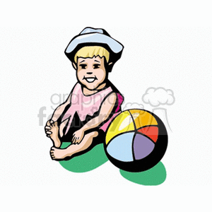 A little girl dressed in pink sitting next to a beach ball