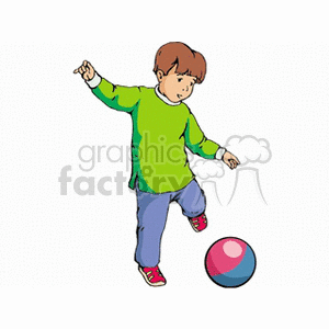 Little boy in a green shirt kicking a red and blue ball