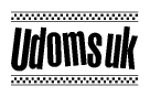 The image is a black and white clipart of the text Udomsuk in a bold, italicized font. The text is bordered by a dotted line on the top and bottom, and there are checkered flags positioned at both ends of the text, usually associated with racing or finishing lines.