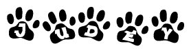 The image shows a series of animal paw prints arranged in a horizontal line. Each paw print contains a letter, and together they spell out the word Judey.