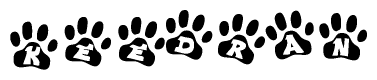 The image shows a series of animal paw prints arranged horizontally. Within each paw print, there's a letter; together they spell Keedran