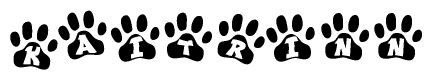 The image shows a row of animal paw prints, each containing a letter. The letters spell out the word Kaitrinn within the paw prints.