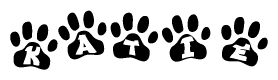 The image shows a series of animal paw prints arranged in a horizontal line. Each paw print contains a letter, and together they spell out the word Katie.