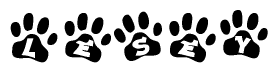 The image shows a series of animal paw prints arranged in a horizontal line. Each paw print contains a letter, and together they spell out the word Lesey.