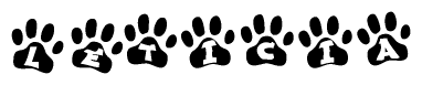 The image shows a row of animal paw prints, each containing a letter. The letters spell out the word Leticia within the paw prints.
