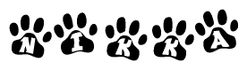 The image shows a series of animal paw prints arranged in a horizontal line. Each paw print contains a letter, and together they spell out the word Nikka.