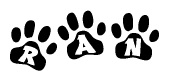 The image shows a row of animal paw prints, each containing a letter. The letters spell out the word Ran within the paw prints.