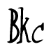 The image is a stylized text or script that reads 'Bkc' in a cursive or calligraphic font.