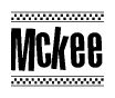 The clipart image displays the text Mckee in a bold, stylized font. It is enclosed in a rectangular border with a checkerboard pattern running below and above the text, similar to a finish line in racing. 