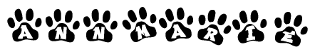 The image shows a series of animal paw prints arranged horizontally. Within each paw print, there's a letter; together they spell Annmarie