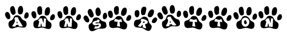 The image shows a row of animal paw prints, each containing a letter. The letters spell out the word Annstratton within the paw prints.