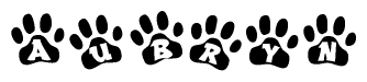 The image shows a series of animal paw prints arranged in a horizontal line. Each paw print contains a letter, and together they spell out the word Aubryn.