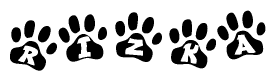 The image shows a series of animal paw prints arranged horizontally. Within each paw print, there's a letter; together they spell Rizka