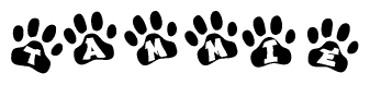 The image shows a row of animal paw prints, each containing a letter. The letters spell out the word Tammie within the paw prints.