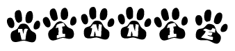 The image shows a series of animal paw prints arranged horizontally. Within each paw print, there's a letter; together they spell Vinnie