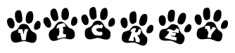 The image shows a row of animal paw prints, each containing a letter. The letters spell out the word Vickey within the paw prints.
