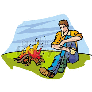 man sitting next to a campfire