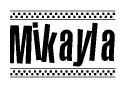 The image is a black and white clipart of the text Mikayla in a bold, italicized font. The text is bordered by a dotted line on the top and bottom, and there are checkered flags positioned at both ends of the text, usually associated with racing or finishing lines.