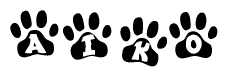 The image shows a series of animal paw prints arranged in a horizontal line. Each paw print contains a letter, and together they spell out the word Aiko.