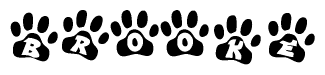 The image shows a series of animal paw prints arranged in a horizontal line. Each paw print contains a letter, and together they spell out the word Brooke.