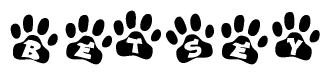 The image shows a series of animal paw prints arranged in a horizontal line. Each paw print contains a letter, and together they spell out the word Betsey.