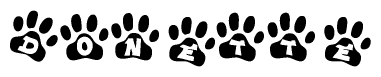 The image shows a series of animal paw prints arranged in a horizontal line. Each paw print contains a letter, and together they spell out the word Donette.