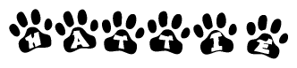 The image shows a row of animal paw prints, each containing a letter. The letters spell out the word Hattie within the paw prints.