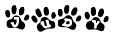 The image shows a series of animal paw prints arranged horizontally. Within each paw print, there's a letter; together they spell Judy