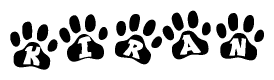 The image shows a row of animal paw prints, each containing a letter. The letters spell out the word Kiran within the paw prints.