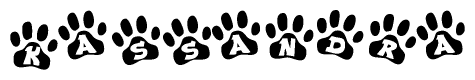 The image shows a series of animal paw prints arranged in a horizontal line. Each paw print contains a letter, and together they spell out the word Kassandra.