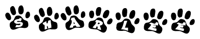 The image shows a row of animal paw prints, each containing a letter. The letters spell out the word Sharlee within the paw prints.