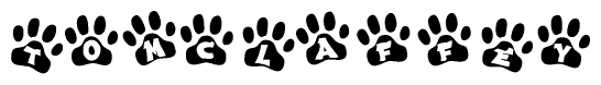 The image shows a row of animal paw prints, each containing a letter. The letters spell out the word Tomclaffey within the paw prints.