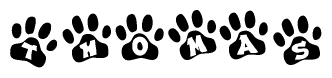 The image shows a series of animal paw prints arranged in a horizontal line. Each paw print contains a letter, and together they spell out the word Thomas.