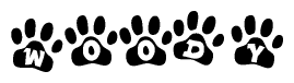The image shows a series of animal paw prints arranged horizontally. Within each paw print, there's a letter; together they spell Woody