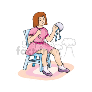 A girl sitting in a chair sewing