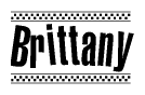 The image is a black and white clipart of the text Brittany in a bold, italicized font. The text is bordered by a dotted line on the top and bottom, and there are checkered flags positioned at both ends of the text, usually associated with racing or finishing lines.